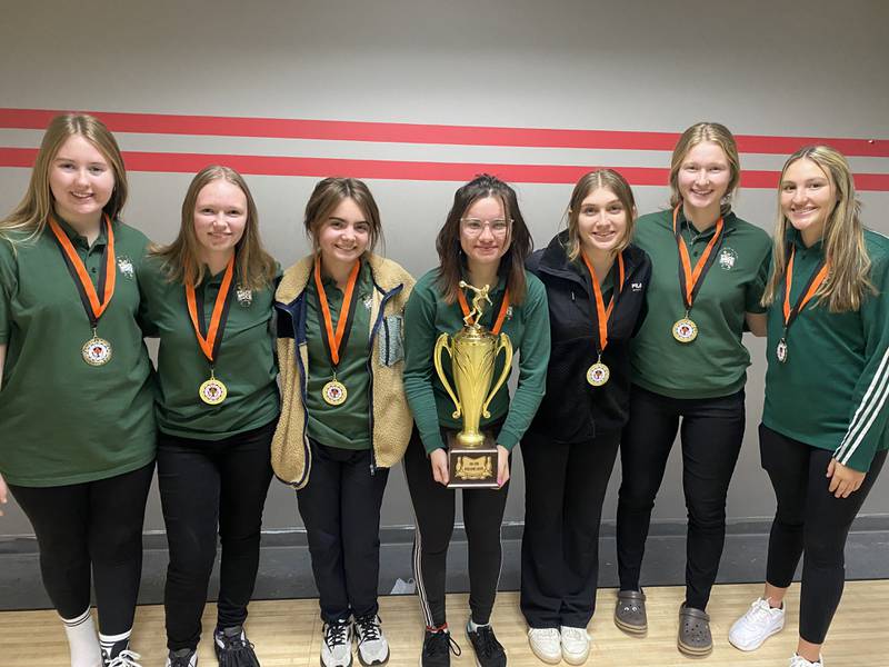 Members of the St. Bede girls bowling team pose for a photo with the trophy they earned for winning the Kewanee Invitational on Saturday, Dec. 4, 2021.