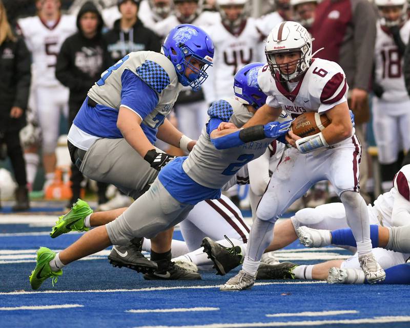 Prairie Ridge's Luke Vanderwiel (6) breaks the tackle of St. Francis's Peyton Shipley (2) on Saturday Nov. 8, 2025, during the second round of the 5A playoff game held at St. Francis's High School.