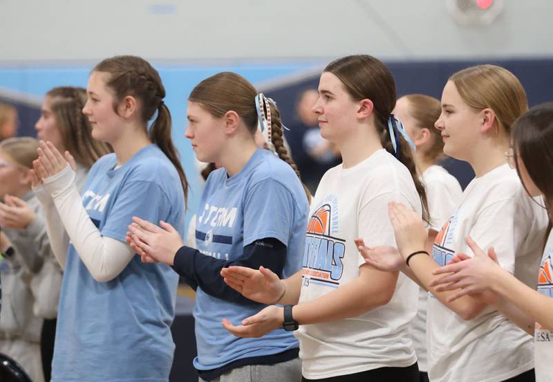 Members of the Bureau Valley Storm seventh-grade girls basketball team appluad during a prep rally on Thursday, Dec. 11, 2025 at Bureau Valley High School in Manlius. The Storm (23-1) will meet undefeated Mt. Sterling Brown County (25-0) for the IESA Class 2A state title at 7:30 p.m tonight.