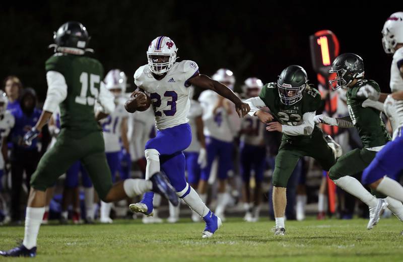 Glenbard South's Jalen Brown (23) heads in for a touchdown Friday September 23, 2022 in Bartlett.