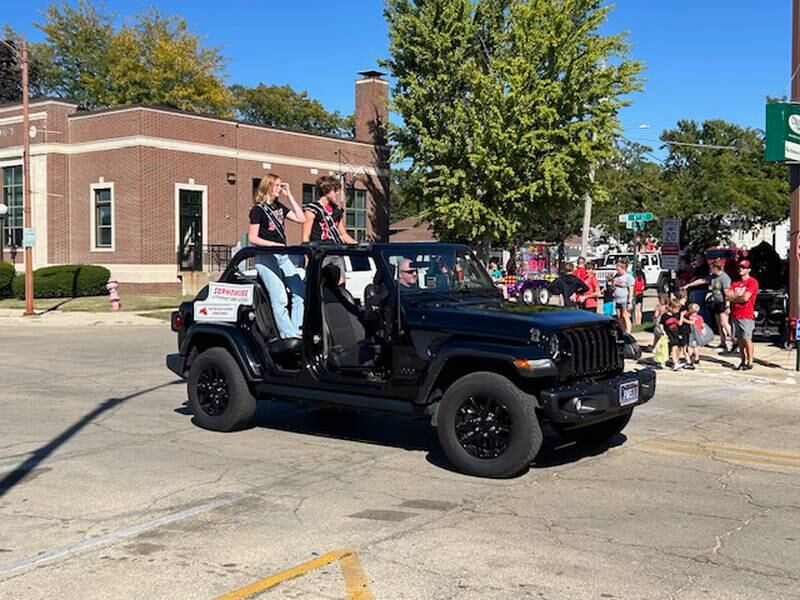 Sophomore attendants Iris Williams and Evan Folk enter the Fulton High School Homecoming parade route Friday, Sept. 20, 2024.