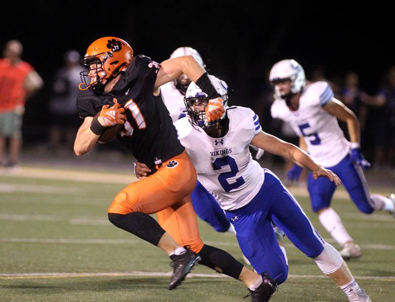 Wheaton Warrenville South’s Colin Moore (31) runs the ball during a home game against Geneva on Friday, Sept. 16, 2022.