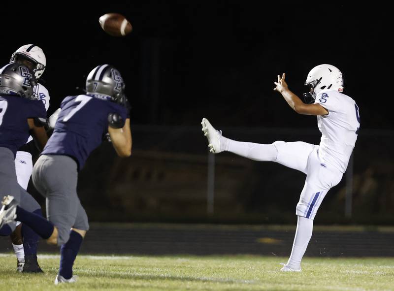 Plainfield South's Leonidas Gamino (9) punts during the varsity football game between Plainfield South and Oswego East on Friday, Sep. 20, 2024 in Oswego.