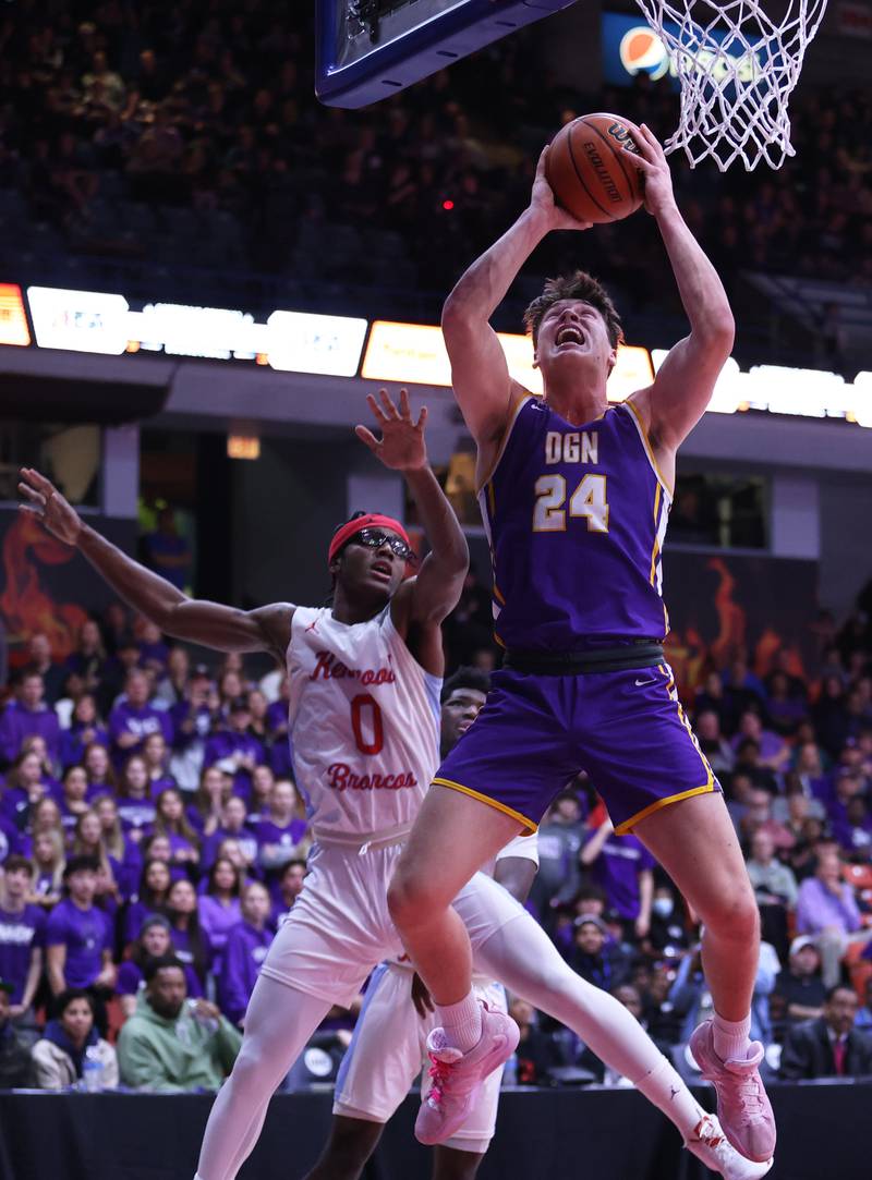 Downers Grove North's George Wolkow (24) throws down a dunk during the boys 4A super-sectional game between Kenwood Academy and Downers Grove North high school in Chicago on Monday, March 6, 2023.