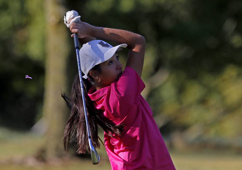 Hampshire’s Estancia Arenas watches her tee shot on the 11th hole during the Fox Valley Conference Girls Golf Tournament Wednesday, Sept. 25, 2024, at Crystal Woods Golf Club in Woodstock.