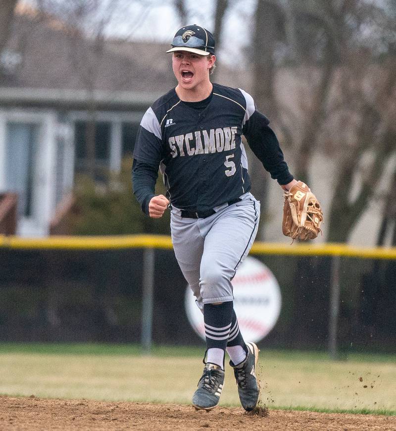 Sycamore's Ethan Steele (5) reacts after fielding a grounder and throwing to first for an out against Plano during a baseball game at Plano High School on Monday, April 4, 2022.