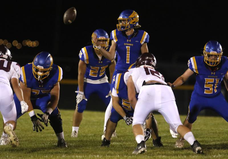 The snap sails past Johnsburg's AJ Bravieri during a Kishwaukee River Conference football game against Marengo on Friday, Sept. 15, 2023, at Johnsburg High School.