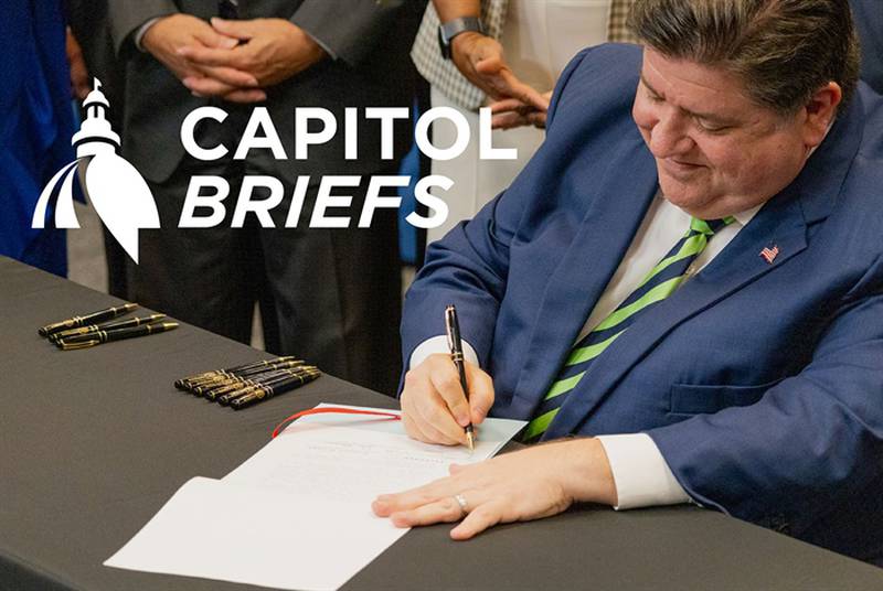Gov. JB Pritzker is pictured signing legislation in a file photo.