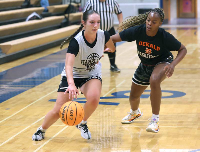 Kaneland’s Kyra Lilly drives against DeKalb’s Zora Watts Thursday, June 12, 2025, in the Geneva High School Varsity Summer League.