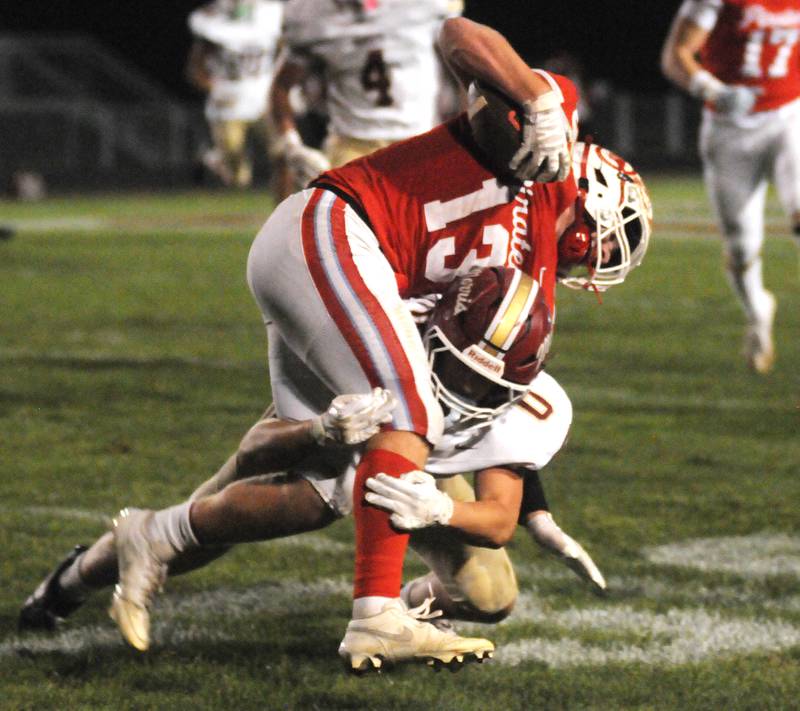 Morris' Kazden Klinker (0) tackles Ottawa's Ethan Poutre on Friday, Oct. 10, 2025 at King Field in Ottawa.