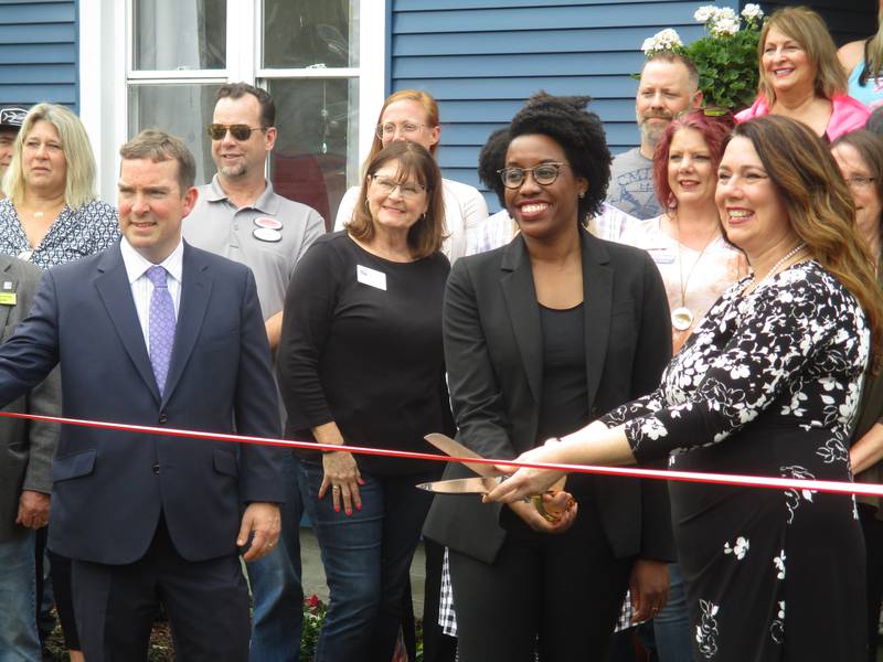 Congresswoman Lauren Underwood, center, and CASA Kendall County Executive Director Jennifer Gilbert, right, cut the ribbon for the formal opening of the CASA Clubhouse in Yorkville on May 25, 2022. Kendall County Board Chairman Scott Gryder is at left. (Mark Foster -- mfoster@shawmedia.com)