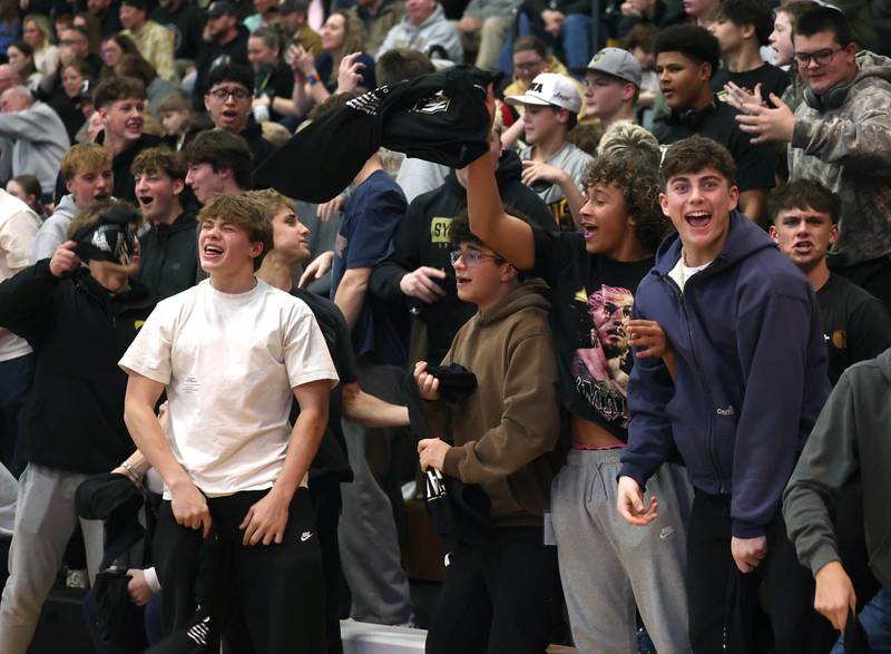 Sycamore fans cheer on their team during their wrestling match against DeKalb Friday, Jan. 16, 2026, at Sycamore High School.