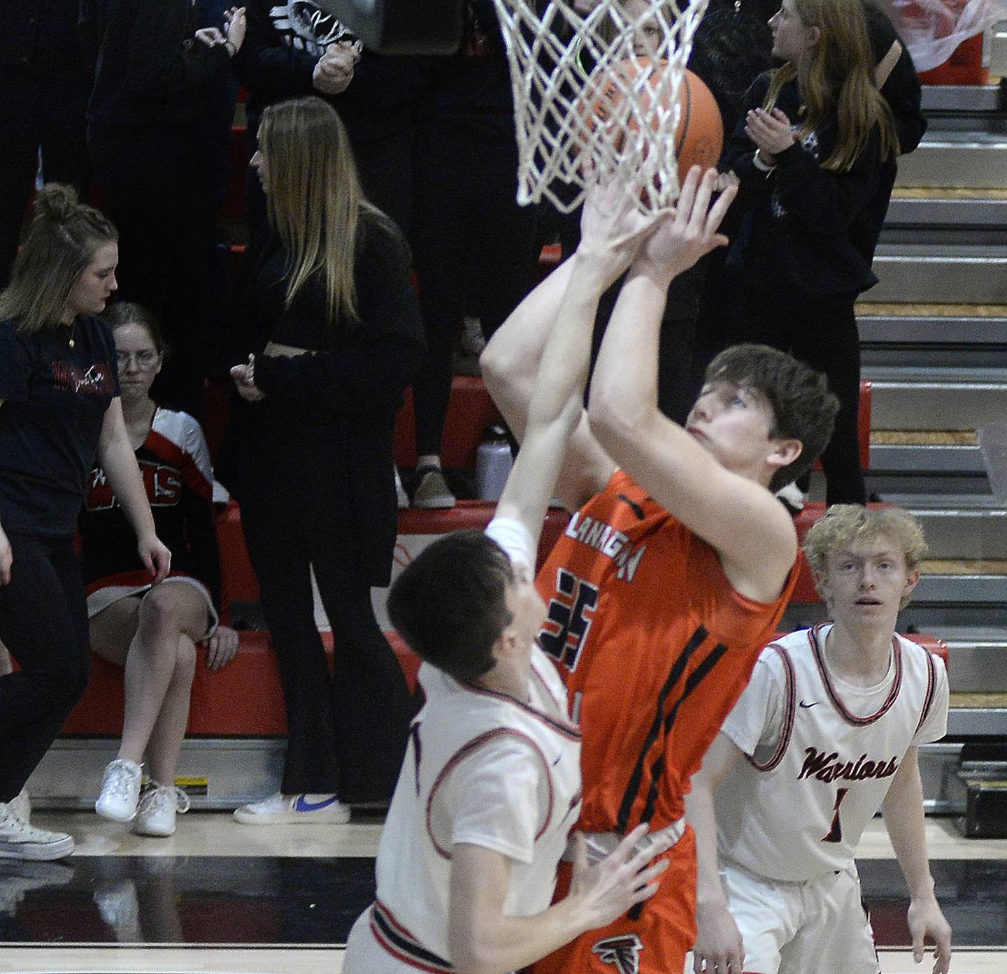 Flanagan-Cornell’s Kesler Collins (35) rises to shoot over Woodland's Nick Plesko as Connor Dodge (1) looks on Wednesday, Feb. 15, 2023, at the Warrior Dome.