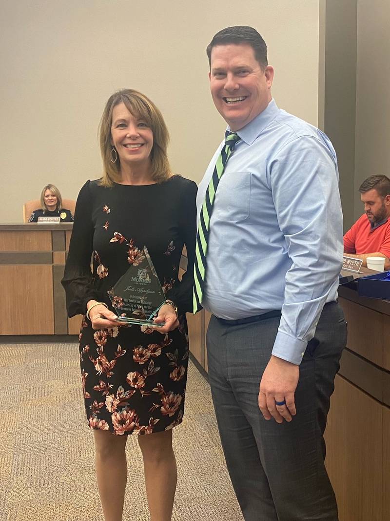 Mayor Brown presented Julie Applegate with an award for her accomplishments as the executive director for Morris Downtown Development Partnership