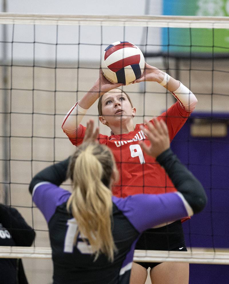 Oregon’s Hayleigh Heuerman plays the ball over the net against Dixon Thursday, Oct. 9, 2025.