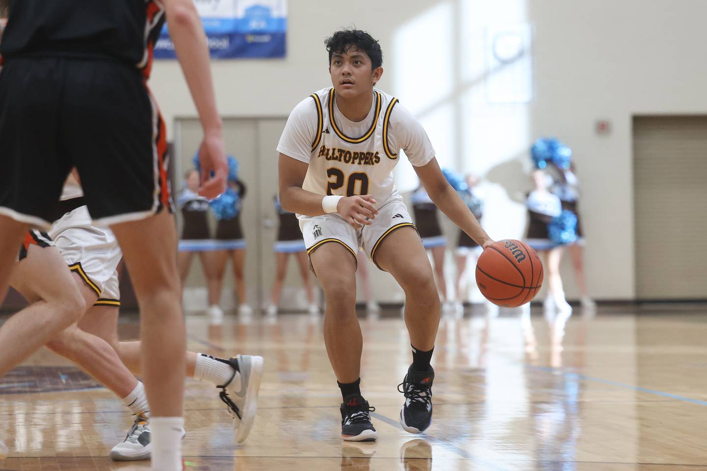 Joliet Catholic’s James Pilapil looks for a play against Lincoln-Way West on Saturday, Feb. 10th 2024 in Joliet.