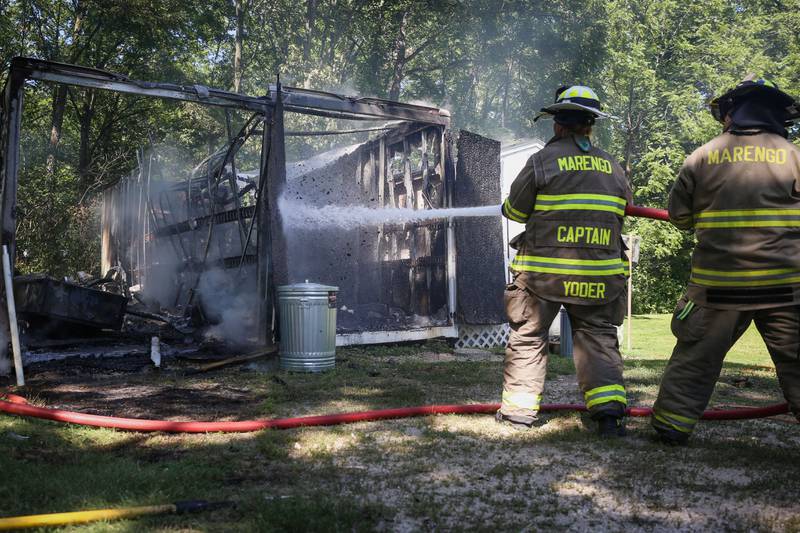 A shed fire in Marengo Thursday, July 14, 2022, injured one man and led to dozens of white doves escaping.