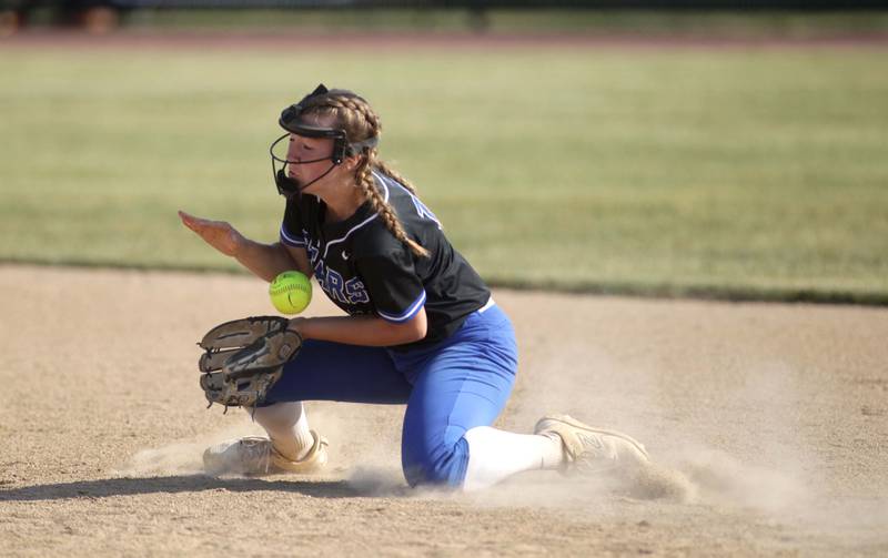 St. Charles North’s Margo Geary grabs a ground ball during a Class 4A St. Charles North Sectional final against Lake Park on Friday, June 2, 2023.
