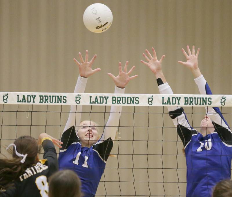 Newark's Bre Dixon (11) and teammate Kodi Rizzo (10) miss the return spike from Putnam County's Ava Hatton (8) in the Class 1A semifinal game on Wednesday, Oct. 16, 2022 at St. Bede Academy in Peru.