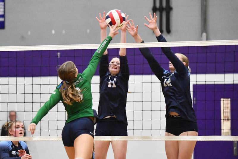 Cissna Park's Sophie Duis, center, and Josie Neukomm jump to block Monday night during the Timberwolves' victory in two sets, 20-23, 27-25, over Windsor/Stewardson-Strasburg in the IHSA Class 1A Lexington Super-Sectional.
