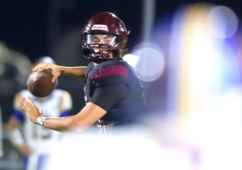 Marengo’s Sam Vandello fires a pass against Johnsburg in varsity football at Rod Poppe Field on the campus of Marengo High School in Marengo on Friday, Oct. 3, 2025.