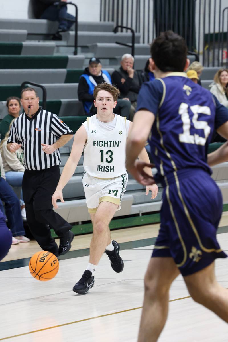 Bishop McNamara's Teddy Fogel brings the ball up during the Fightin' Irish's 62-25 victory over Chesterton Academy on Wednesday, Jan. 7, 2026.