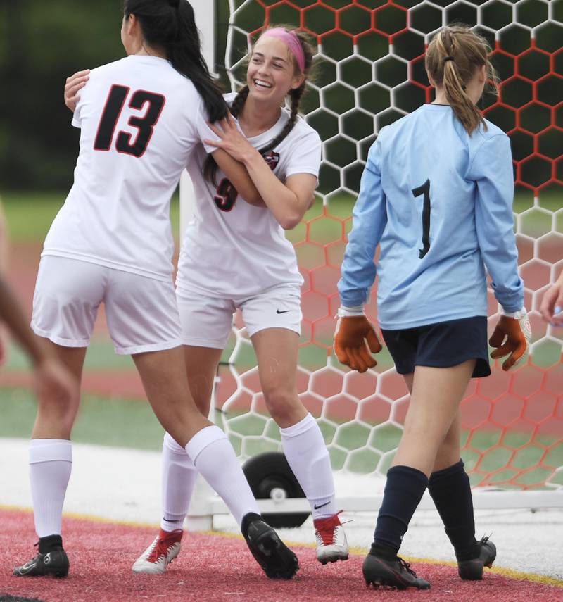 Lincoln-Way Central’s Emma Vogler (9) smiles after scoring the first goal of the game on a header from a corner-kick for the first goal against Evanston in the Class 3A IHSA state girls soccer third-place game in Naperville on Saturday, June 4, 2022.