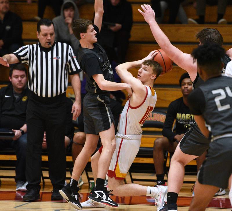 Glenbard North's Jack Schager, left, pressures Batavia's Nate Nazos during Tuesday’s boys basketball game in Batavia.