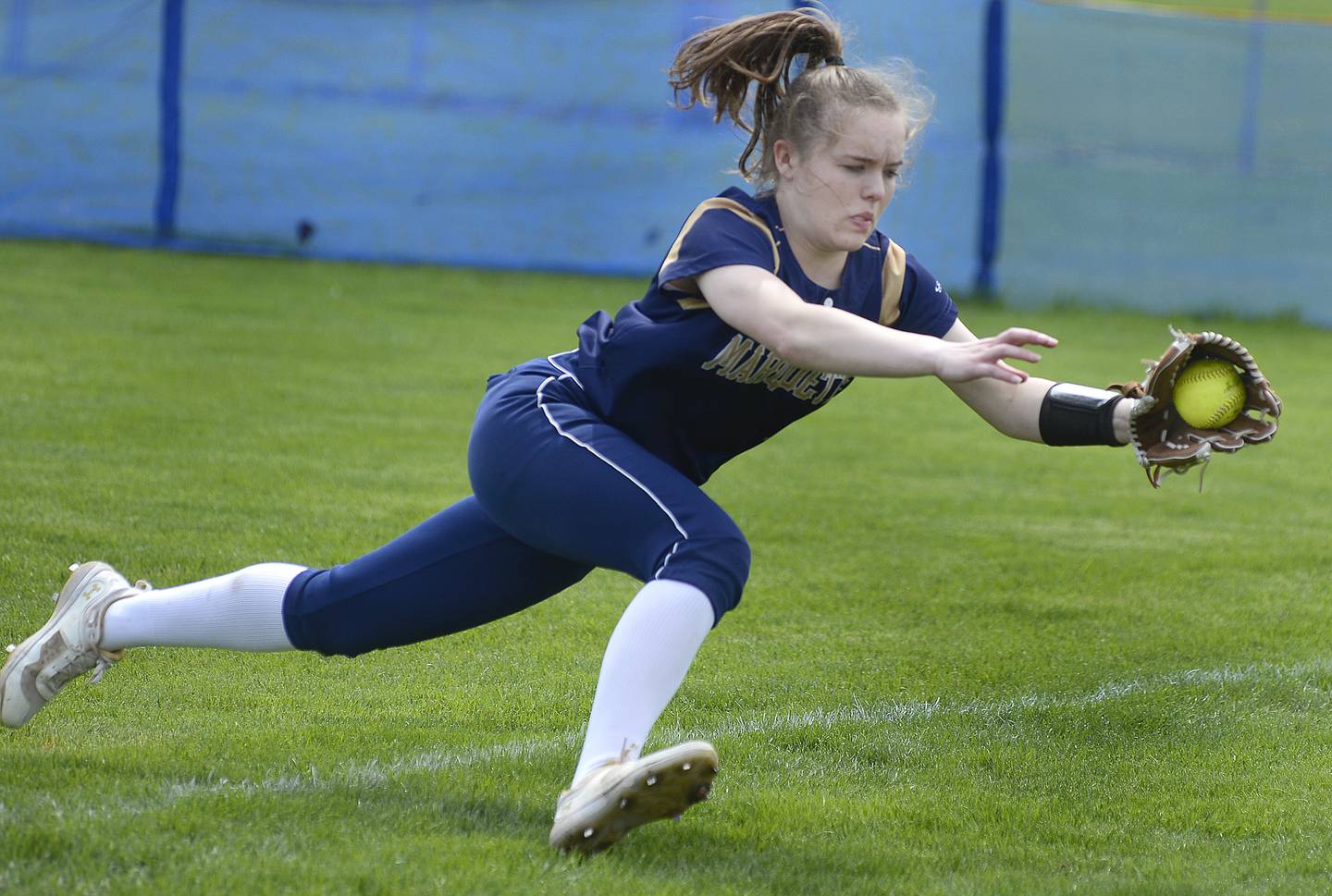 Marquette right fielder Emma Rinearson makes a diving catch on a line drive in the fourth inning Saturday, April 30, 2022, against the Serena Huskers in Ottawa.