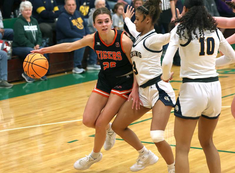 Crystal Lake Central's Hadley Ferrero goes baseline against Sterling's Delali Amankwa during their Class 3A sectional semifinal game Tuesday, Feb. 25, 2025, at Boylan Catholic High School in Rockford.