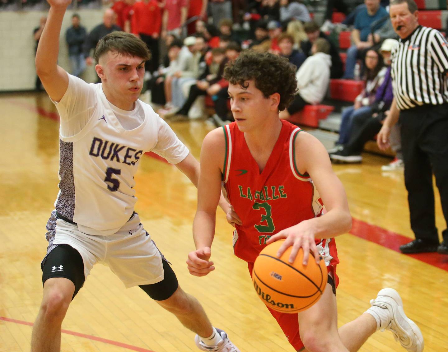 L-P's Mikey Hartman dribbles around Dixon's Erick Sotelo during the Class 3A Regional semifinal game on Wednesday, Feb. 26, 2025 in Sellett Gymnasium at L-P High School.