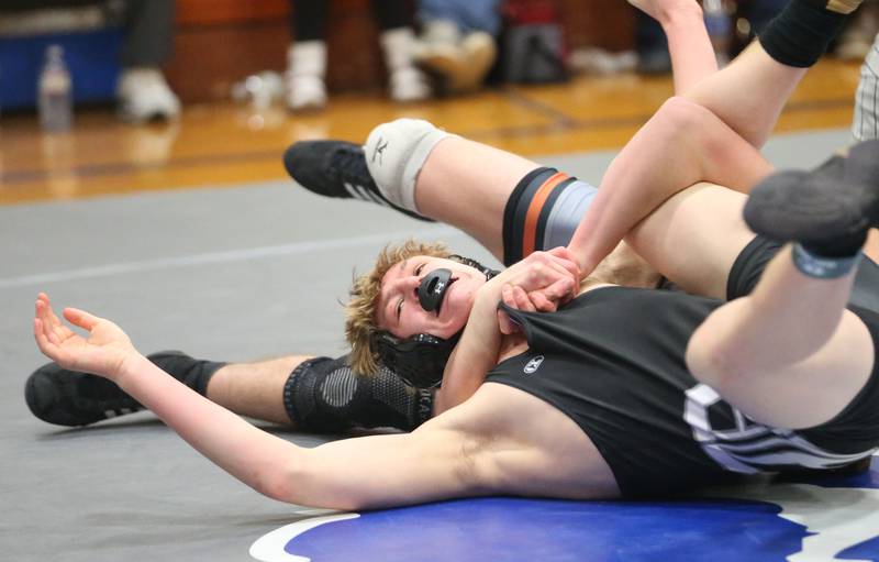 Dixon's Blake Dingley wrestles Sandwich's Joshua Kotalik during the Class 1A Regional meet on Saturday, Jan. 31, 2026 at Princeton High School.