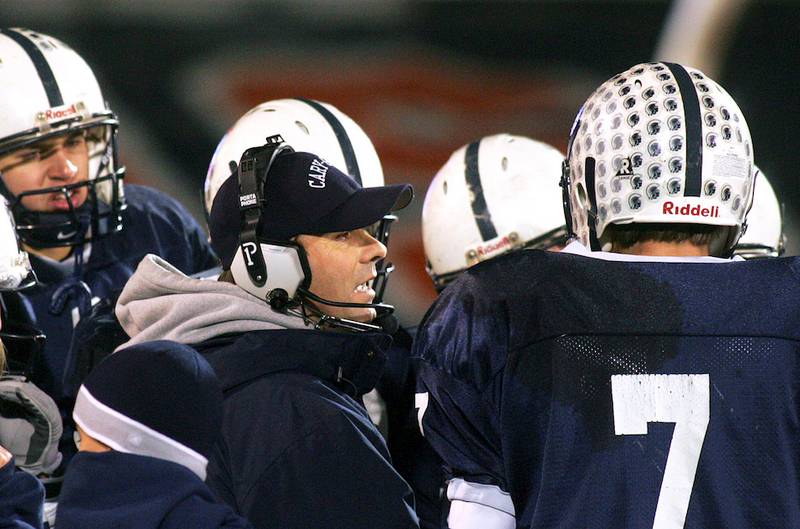 Cary-Grove head coach Bruce Kay huddles during a time out at the 2004 state football title game against Libertyville in Champaign on Saturday Nov. 27, 2004.