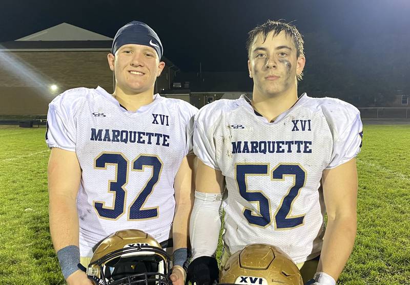 Marquette seniors Grant Dose (32) and Austin Ferracuti (52) led the Crusaders to a 51-6 victory over Elmwood/Brimfield on Friday, Oct. 10, 2025, at Elmwood.