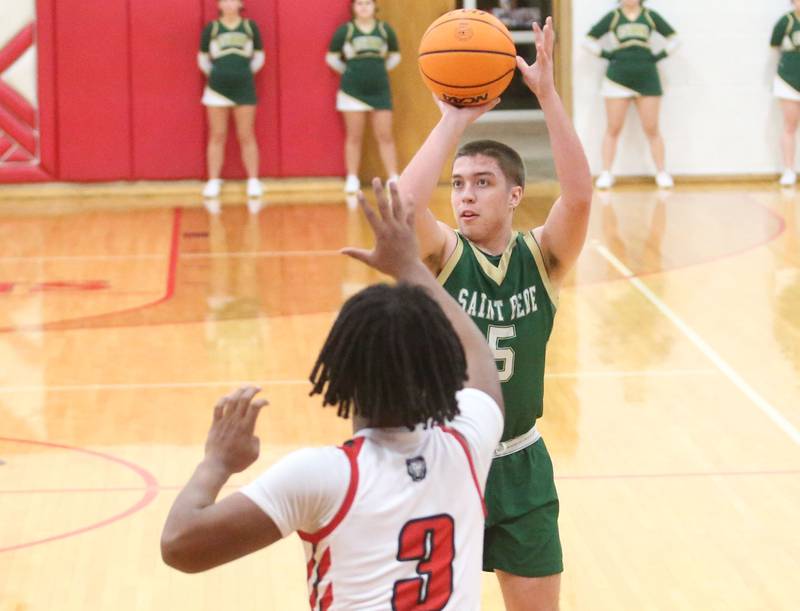 St. Bede's Halden Hueneburg lets go of a shot over LaMoille's Cody Winn on Tuesday, Feb. 11, 2025 at LaMoille High School.
