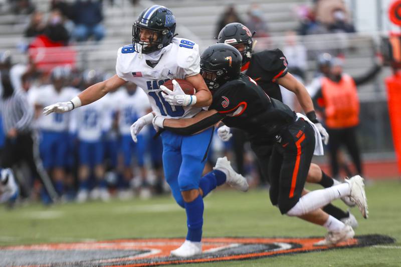 Lincoln-Way East receiver Max Tomczak runs for a first down after the catch on Friday, April 23, 2021, at Lincoln-Way West High School in New Lenox, Ill.
