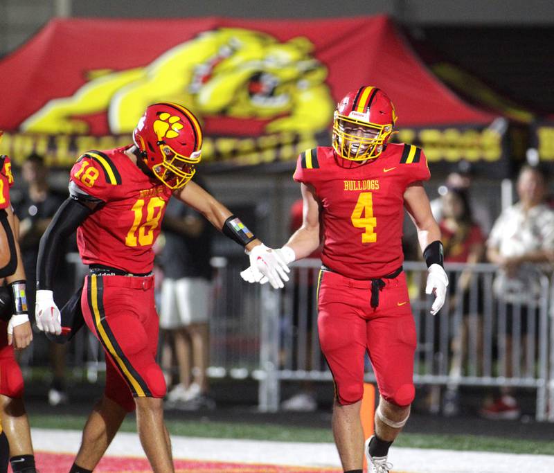 Batavia’s Charlie Whelpley (right) is congratulated by teammate C.J. Valente (left) during the season-opener against Phillips in Batavia on Friday, Aug. 25, 2023.