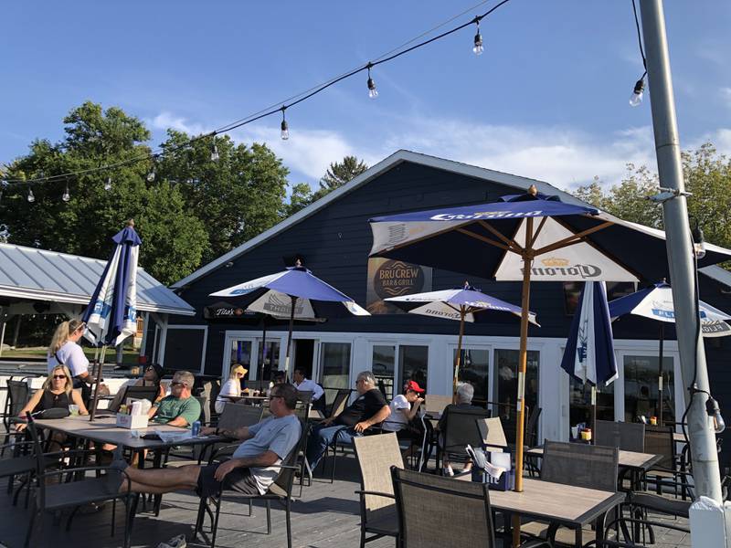 With temperatures in the upper 80s, patrons sit on the deck on Thursday, Oct. 2, 2025, at The Bru Crew Bar & Grill, 614 Bald Knob Road, Johnsburg. The restaurant was closed for a month and reopened with a new name and new owners.