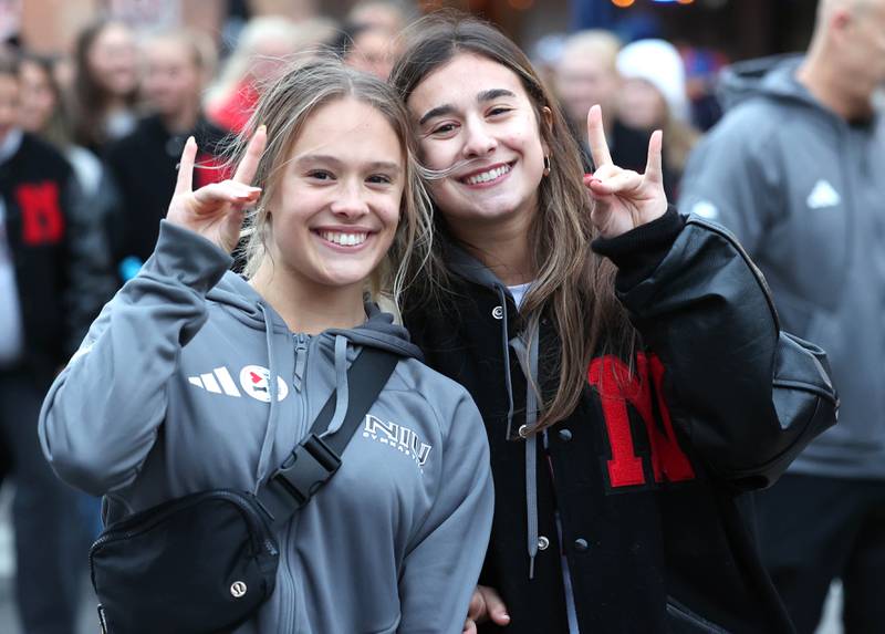Northern Illinois University student athletes has some fun as they walk in the March of the Huskies parade during the NIU Huskie Homecoming Block Party Thursday, Oct. 12, 2023, in downtown DeKalb.
