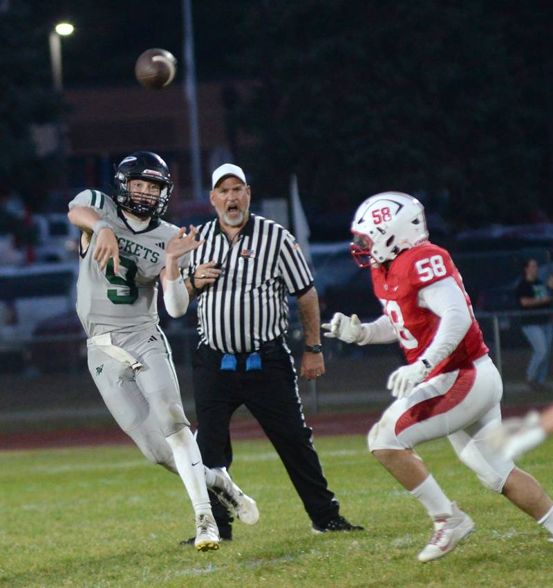 Rock Falls quarterback Connor Fritz throws a pass as Oregon's Tristan Smith-Van Cura looks to tackle on Friday, Sept. 19, 2025 at Landers-Loomis Field in Oregon.