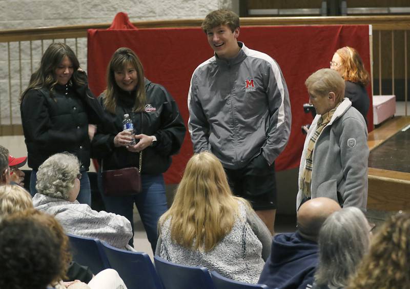 Christian Bentancur talks with family and friends Friday, Jan. 13, 2023, before he announced that he will attend Clemson University to play Division I football, at Marian Central High School. Bentancur, a highly recruited tight-end, narrowed his section down to Clemson from his final three colleges. The other two colleges were Ohio State and Oregon universities.