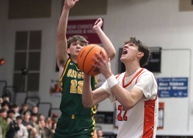 McHenry’s Blake Renfro, right, works under the net against Crystal Lake South’s Nick Stowasser in varsity boys basketball on Friday, Feb. 20, 2026, at McHenry High School in McHenry.