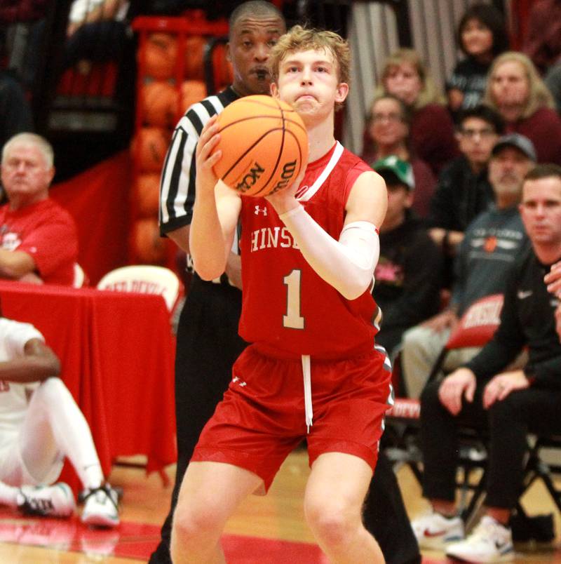 Hinsdale Central’s Eric Kozys attempts three points during the Hinsdale Holiday Classic championship game against Brother Rice on Monday, Dec. 30, 2024 in Hinsdale.