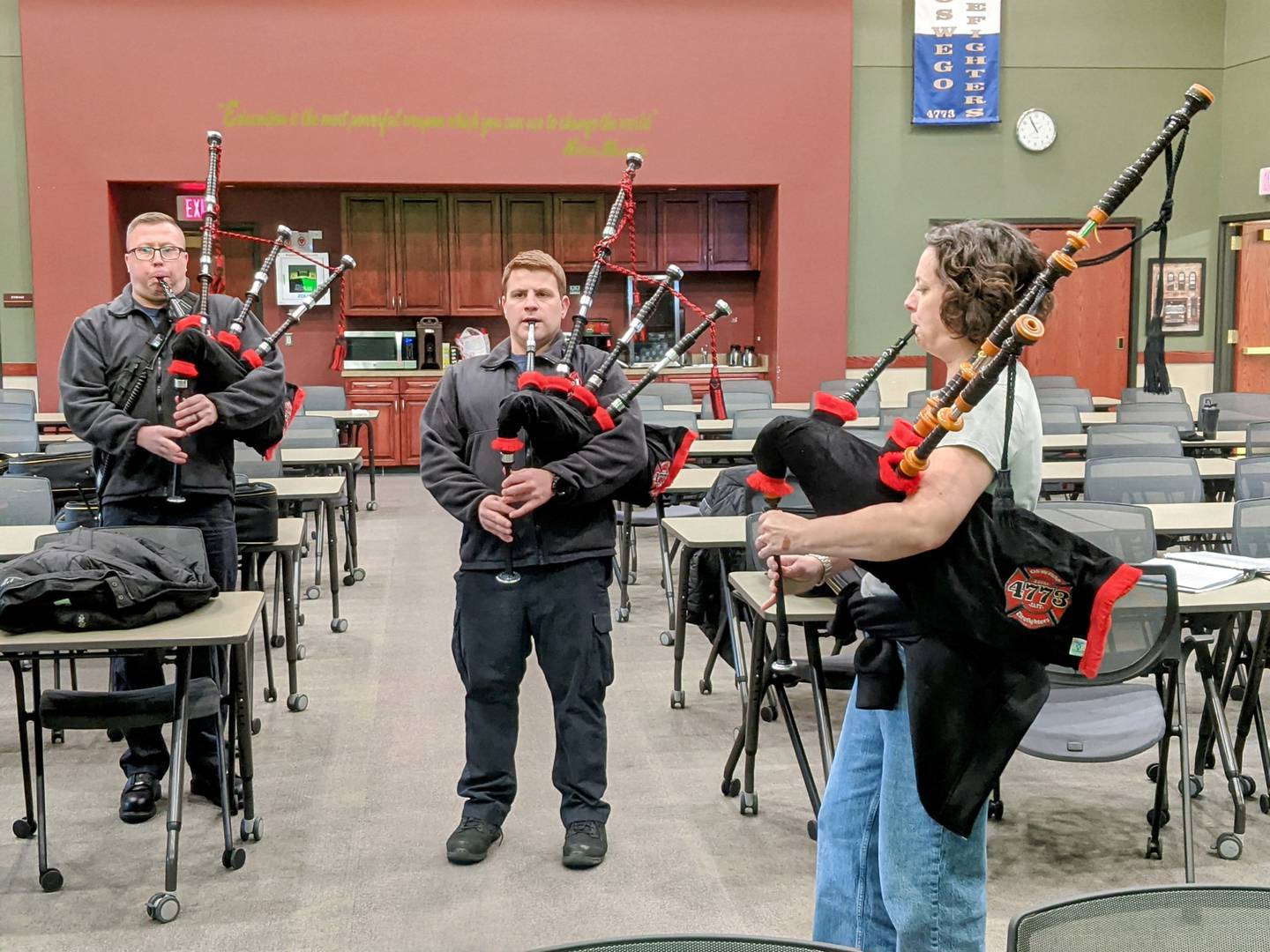 The Oswego Firefighters Pipes and Drums Local 4773 rehearses with music instructor Kate Longid.