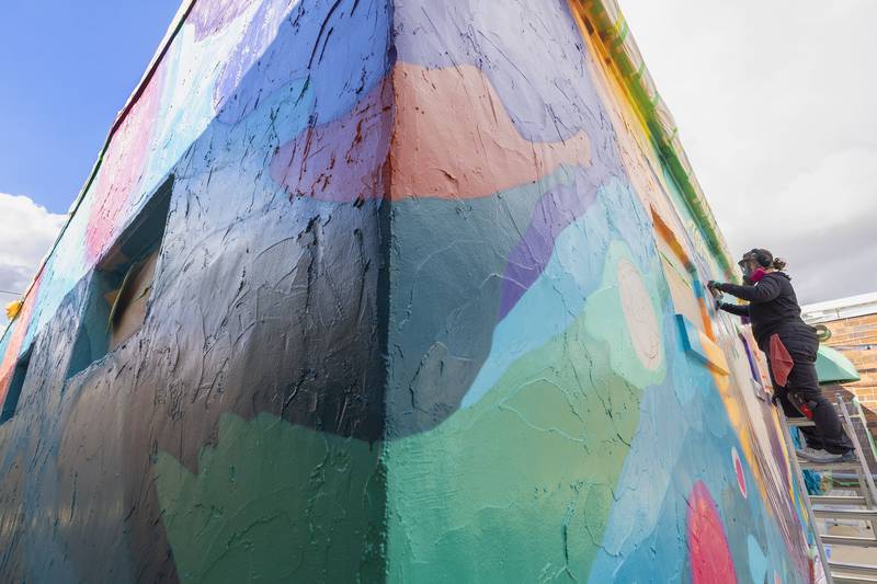 The mural makes its way around the corner to the south side of the building. A small sidewalk there connects First Avenue with the back alley. About the little used walkway: “I think it’s great they wanted to include that side as well as an inspiration,” Hermes said.