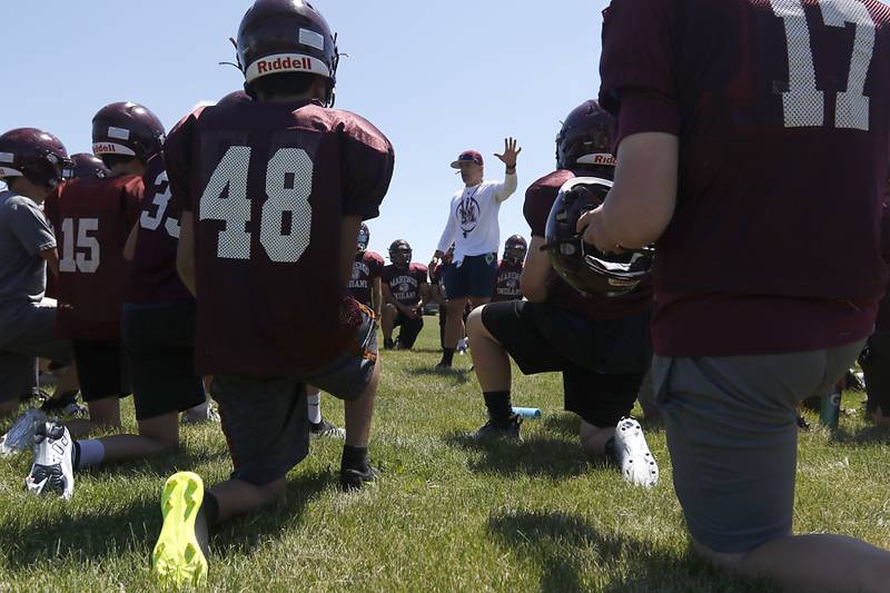 Marengo Head Coach Paul Forsythe talks to his team during summer football practice Monday, June 27, 2022, at Marengo Community High School in Marengo.