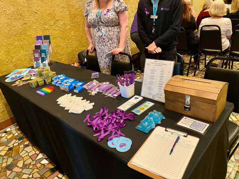 Resource and outreach items were on display throughout the foyer at the annual Safe Passage Domestic Violence Candlelight Vigil and Survivor Speak-Out inside the Egyptian Theatre, 135 N. Second St. in downtown DeKalb on Monday, Oct. 2, 2023.