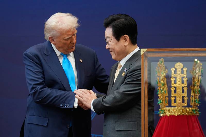 President Donald Trump shakes hands with South Korean President Lee Jae Myung as they attend a high honor ceremony at the Gyeongju National Museum in Gyoeongju, South Korea, Wednesday, Oct. 29, 2025. (AP Photo/Mark Schiefelbein)