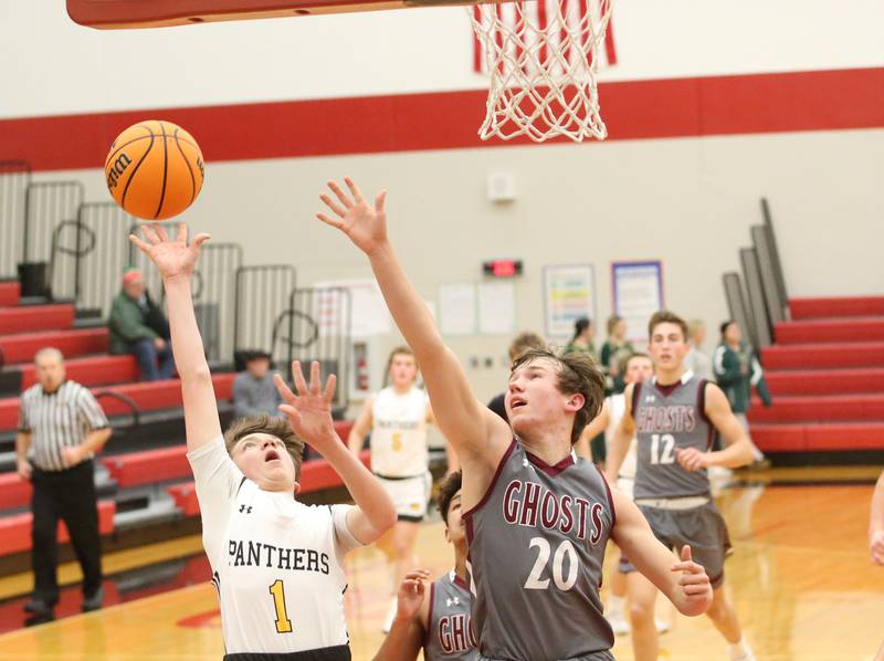 Putnam County's AJ Furar lets go of a the ball under the net as Illinois Valley Central's Hudson Stickel defends during the 50th annual Colmone Classic on Thursday, Dec. 12, 2024 at Hall High School.