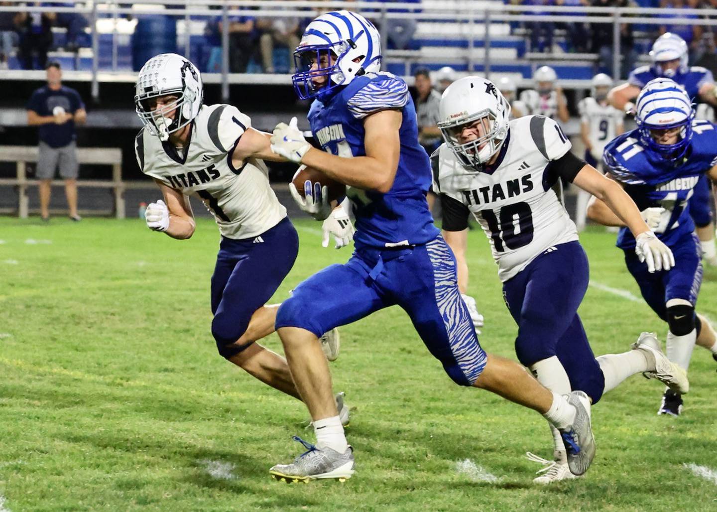Princeton sophomore Jack Oester races for a 49-yard reception down to the 8-yard line early in the third quarter Friday night at Bryant Field. Monmouth-Roseville spoiled the 2025 Princeton Homecoming game with a 36-6 victory.